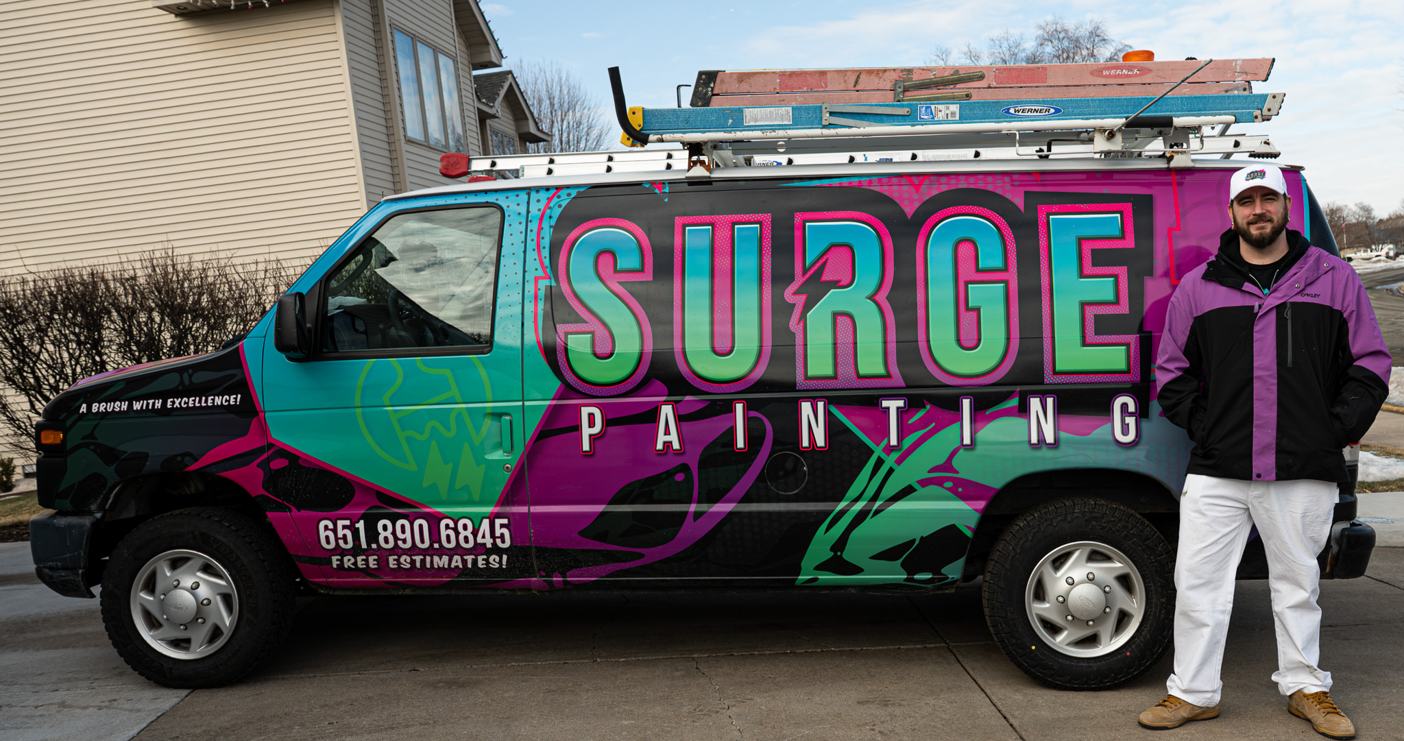 Surge Painting van and the person standing beside it